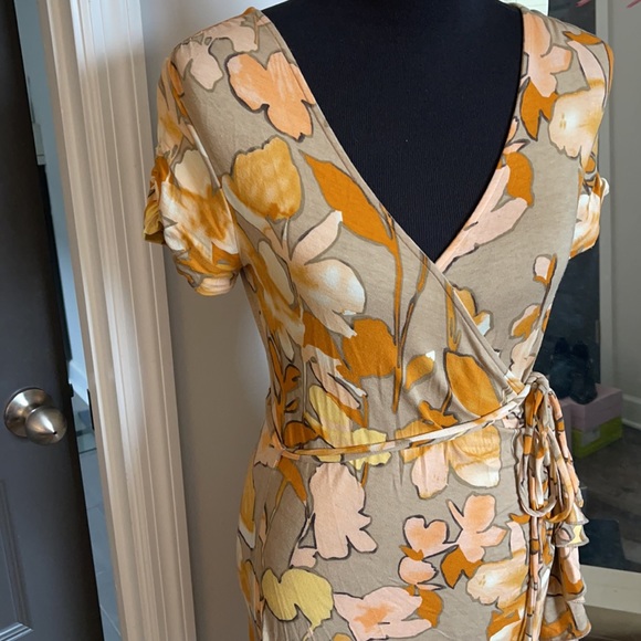 Fun Flirty and Flattering Faux Wrap Floral dress! Gently used. Only worn twice. - Picture 2 of 6